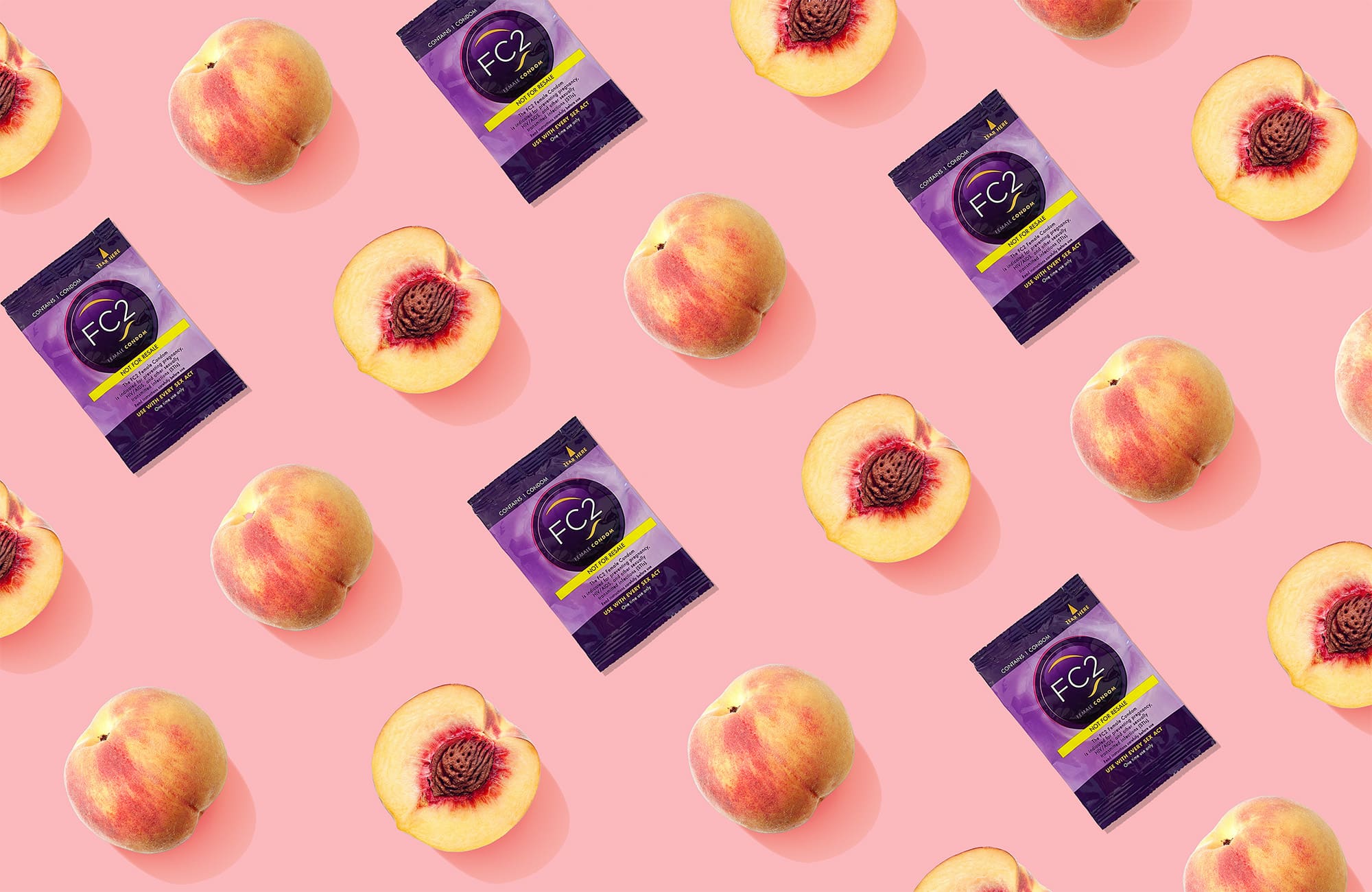  A repeating pattern of FC2 condom packets and whole and halved peaches on a pink background, symbolizing intimacy and health in a playful, colorful design.